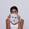 Load image into Gallery viewer, Woman holding Spotless Skin Balancing Sheet Mask – Best Anti-Blemish Mask for Oily & Acne-Prone Skin | Infused with Manuka Honey & Helichrysum for Clear, Hydrated Skin