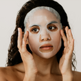 Load image into Gallery viewer, Woman wearing Luminouss Hydration Rescue Sheet Mask – Best Moisturizing Face Mask for Dry & Dehydrated Skin | Infused with Jackfruit, Coconut Water & Ginger